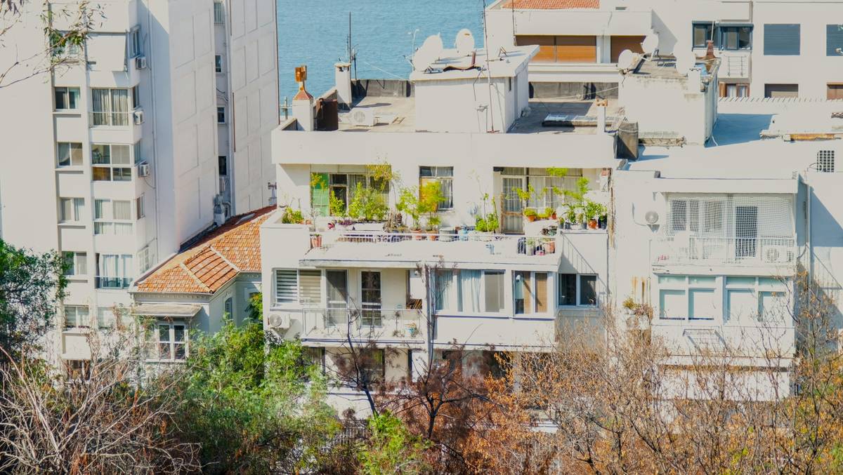 Vertical planter setup on a small balcony garden apartment showing space-saving arrangement